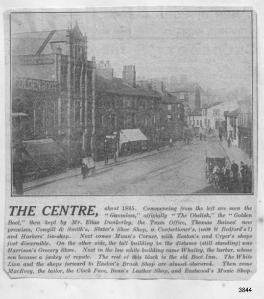 A black and white photo of a street with buildings and people

Description automatically generated with low confidence