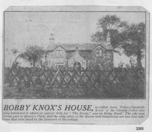 A black and white photo of a house with a fence and trees

Description automatically generated with medium confidence