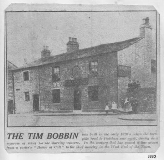 A black and white photo of a house with people sitting in the front

Description automatically generated with low confidence